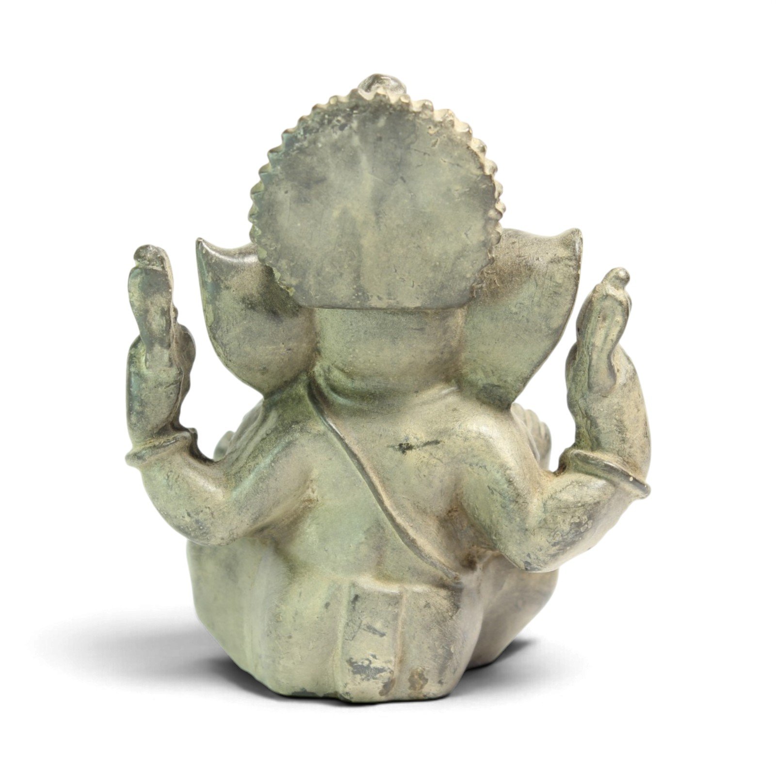 Back view of the baby Ganesha statue showing headdress and raised arms from behind