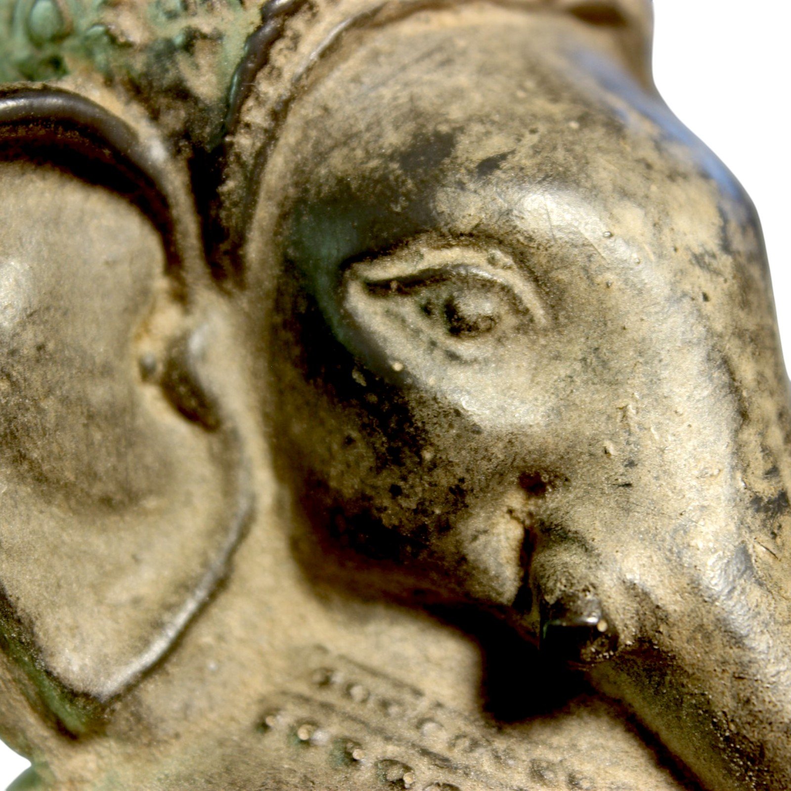 Extreme close-up of the elephant eye and trunk texture on the resin statue