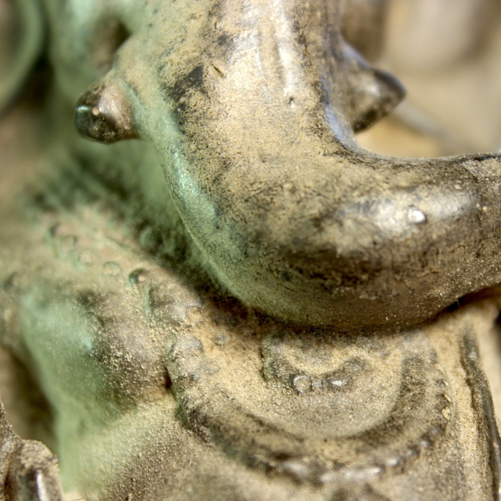 Macro detail of trunk curve and hand resting against the belly