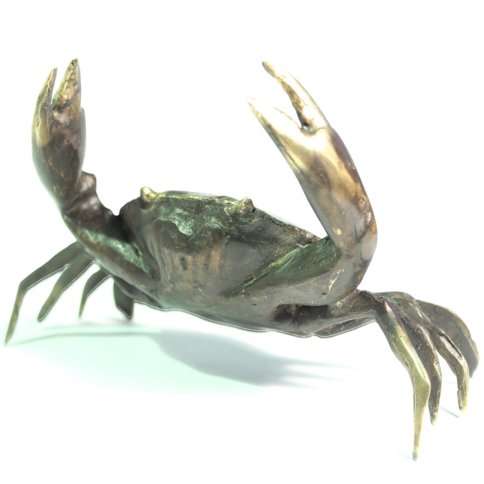 Brass crab figurine with claws raised, black oxidized finish, angled front-side view