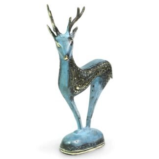 Brass deer figurine with verdigris patina and gold antlers, front three-quarter view