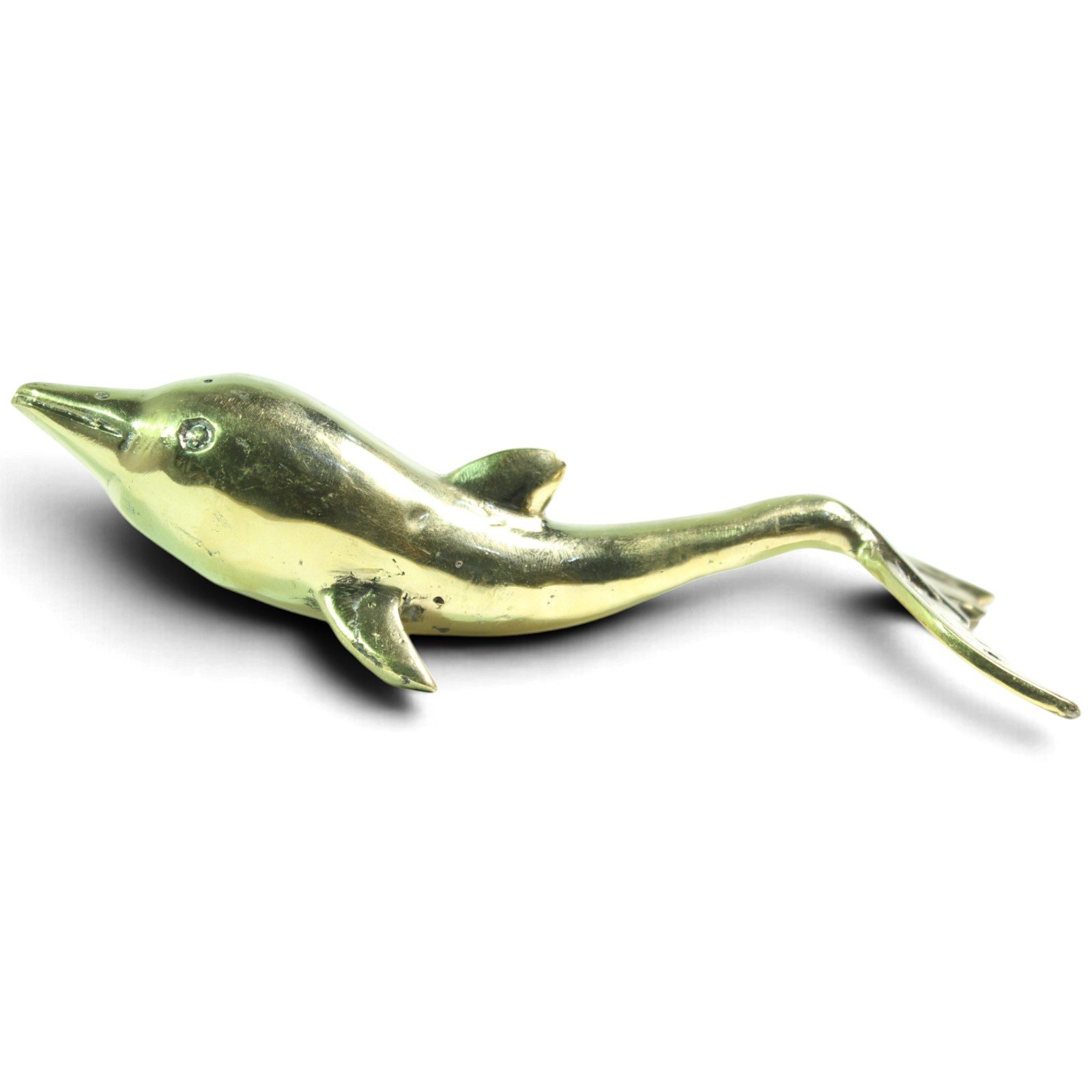 Brass dolphin figurine shown at an angle with tail curving upward