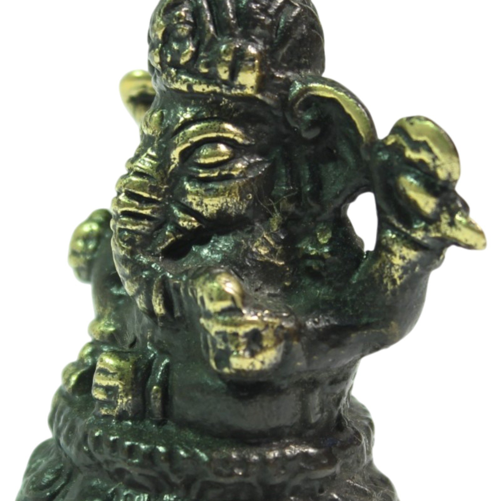 Close-up of the Ganesha face showing brass patina and casting texture