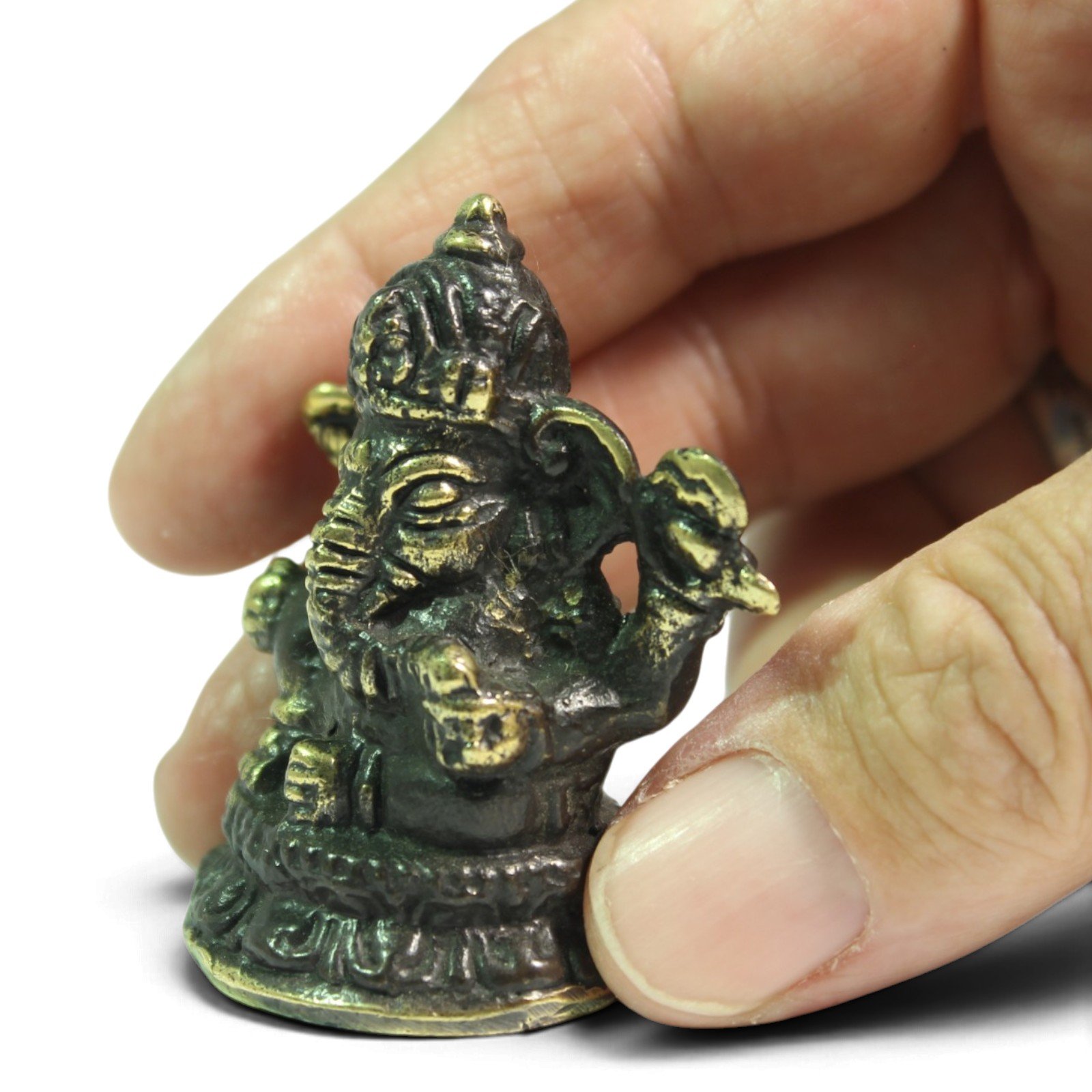 Close-up side angle of the figurine held between fingers showing finish detail