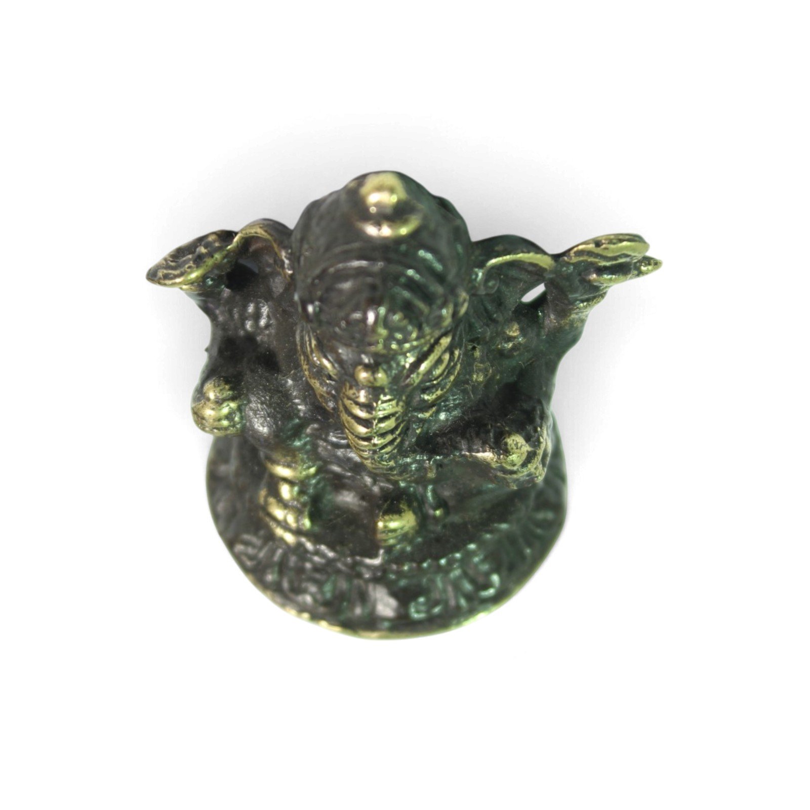 Top-down view of the figurine showing crown point and ear shapes