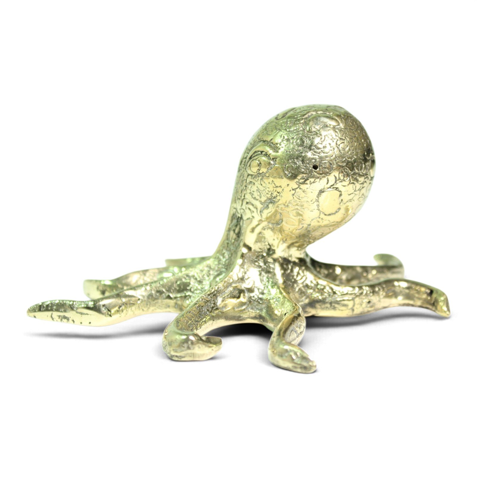 Side view of the gold-tone brass octopus showing its low, spread stance