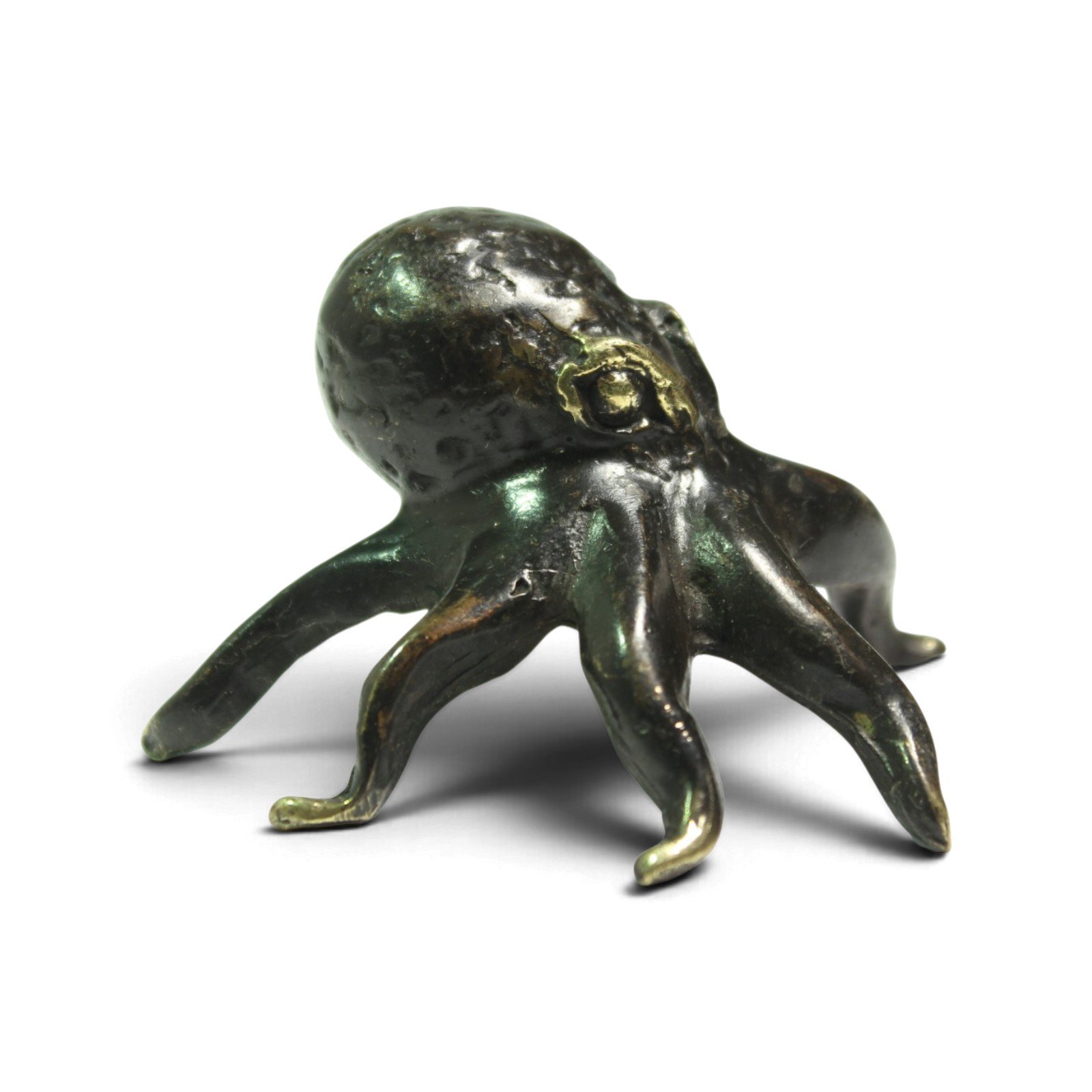 Three-quarter view of the brass octopus showing textured head detail