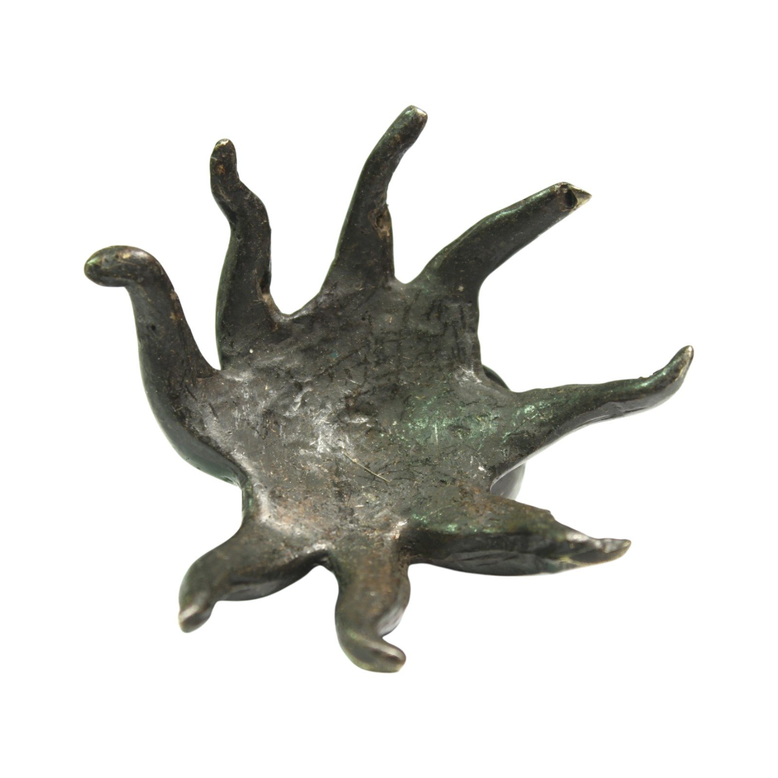 Underside view of the brass octopus figurine showing all eight legs