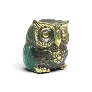 Solid brass owl bust figurine with black oxidized finish and teal patina patch on wing