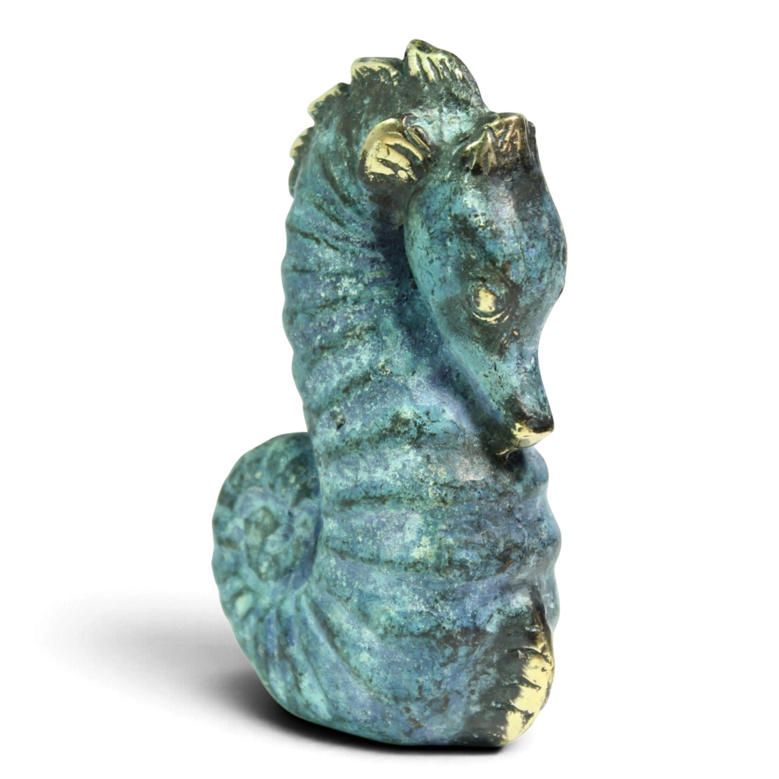 Brass seahorse figurine with verdigris finish, three-quarter front view showing head and curled tail
