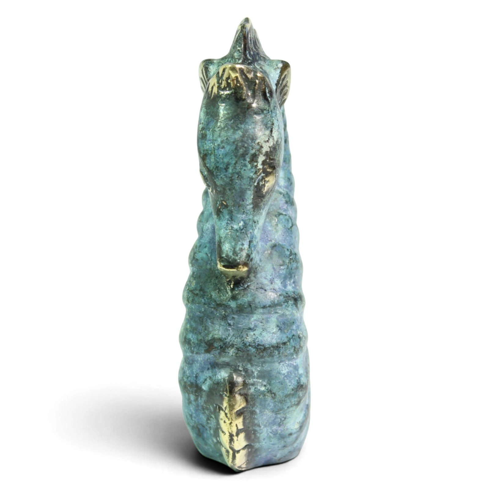 Front-facing view of brass seahorse figurine highlighting textured ridges and gold-toned face