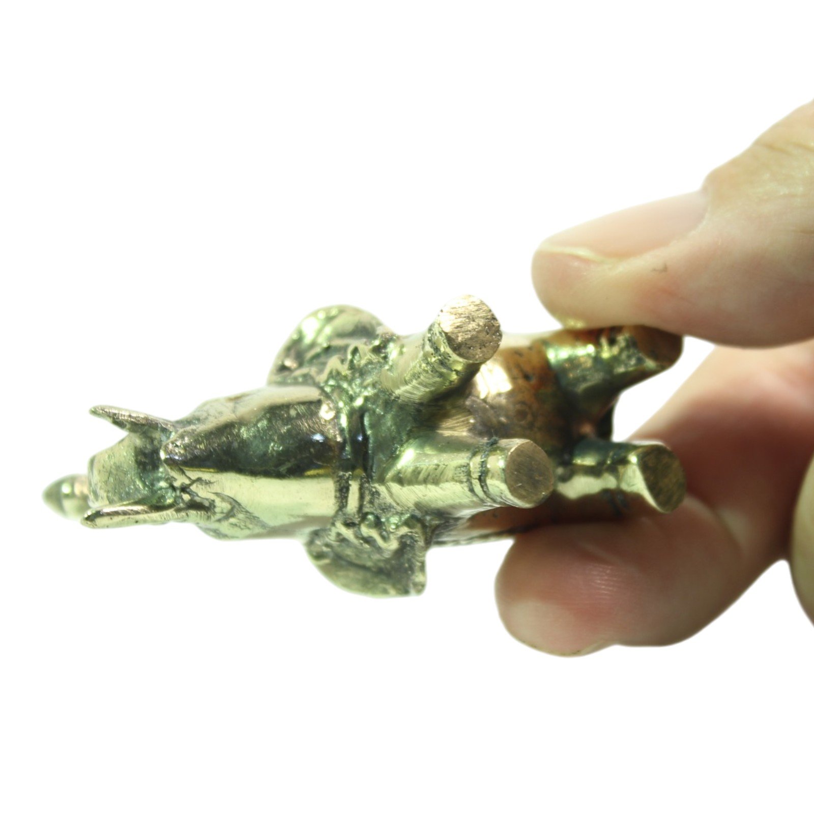 Underside view of brass elephant figurine showing base and leg casting marks