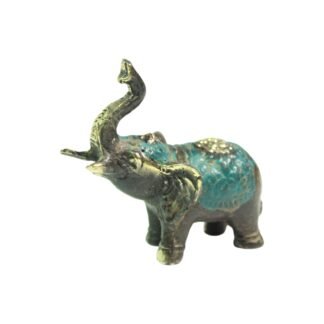 Small brass elephant figurine with raised trunk and teal patina on white background