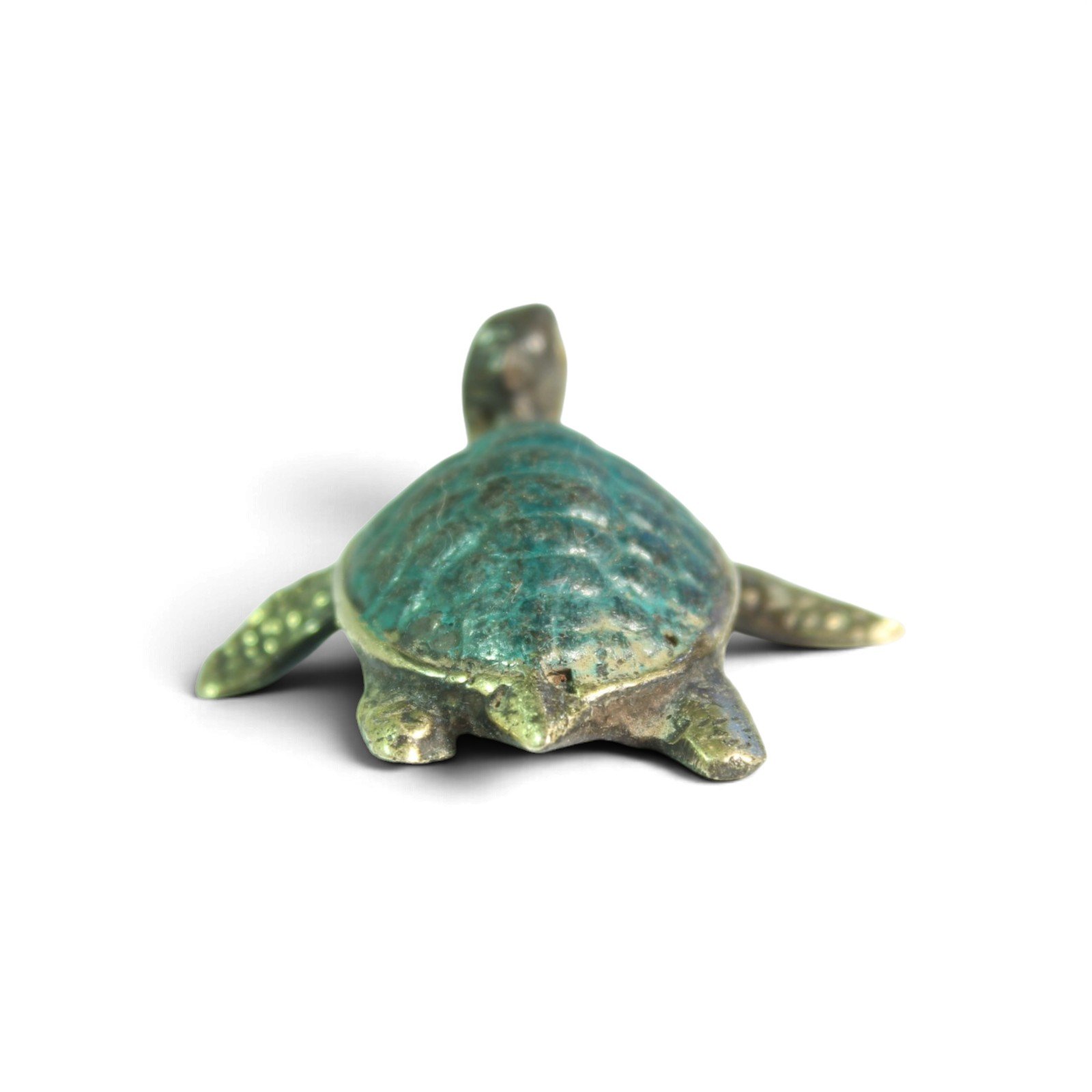 Rear view of brass turtle figurine showing tail and hind flippers