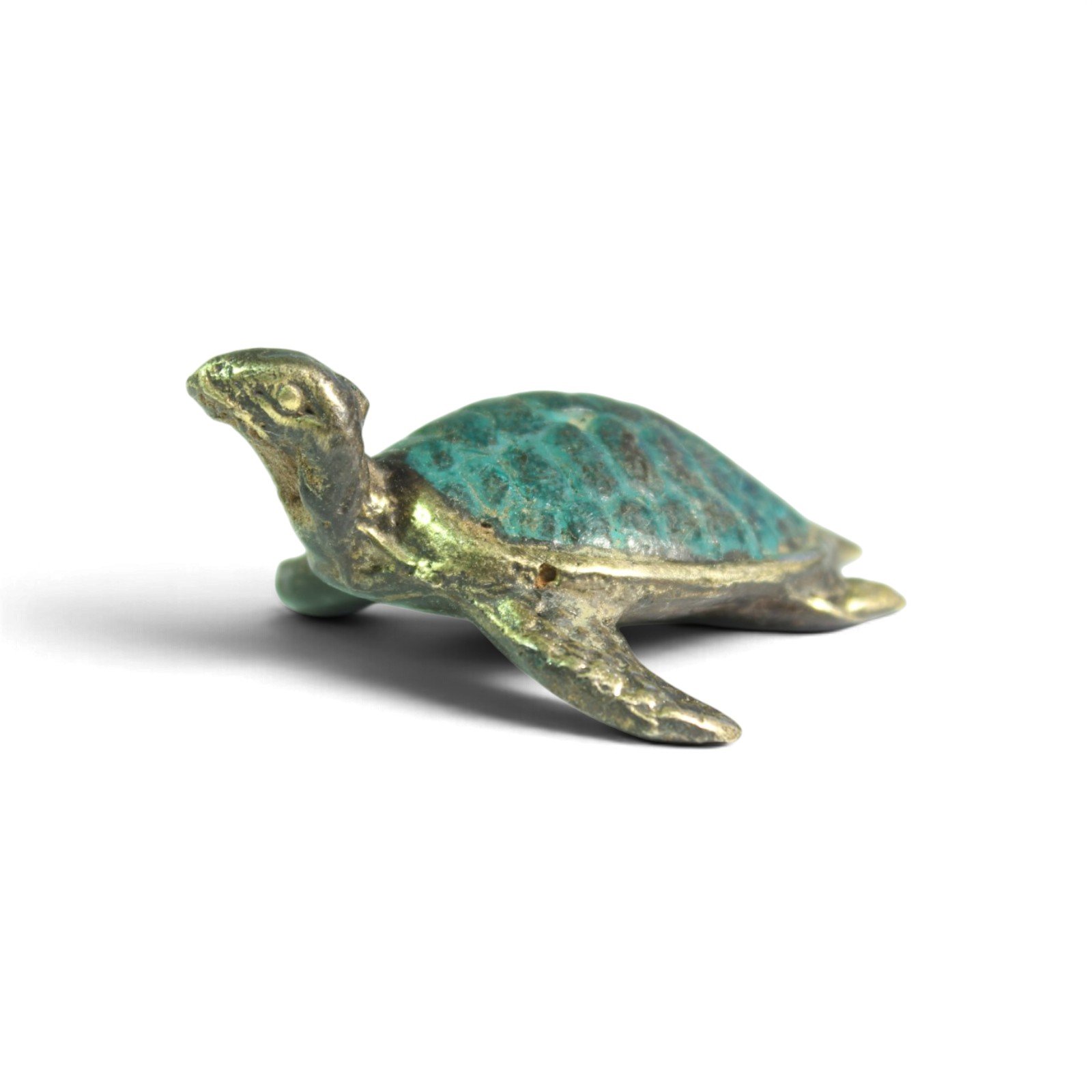 Small brass turtle figurine with teal patina shell, three-quarter side view