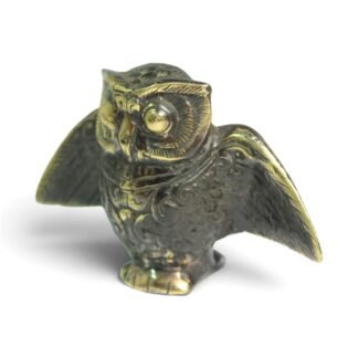 Hand-cast brass owl figurine with spread wings, black oxidized finish, three-quarter front view