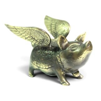 Brass winged pig figurine in black and gold two-tone finish, front angle view