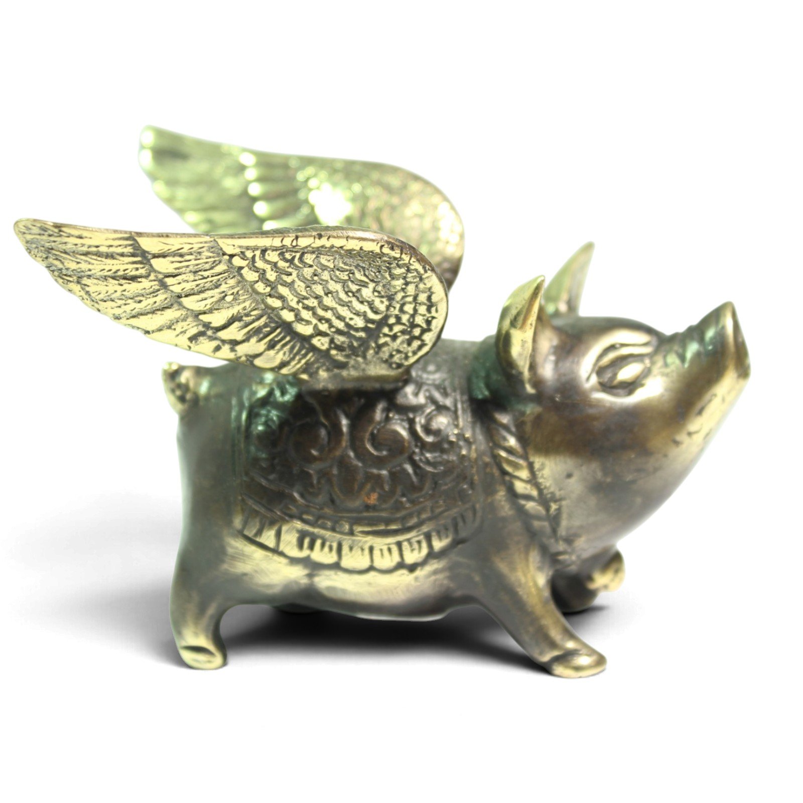 Side view of hand-cast brass pig showing carved wing feathers and back pattern