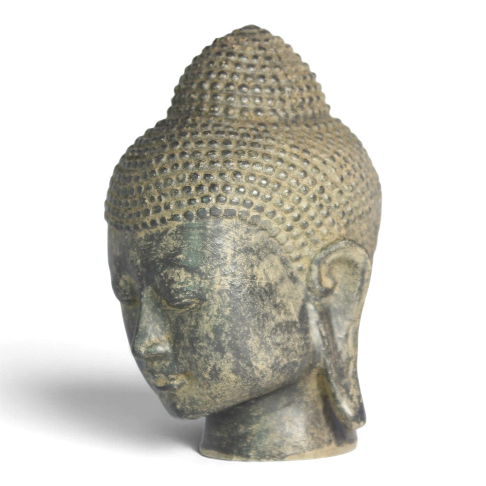 Buddha head statue viewed from a left-turned angle