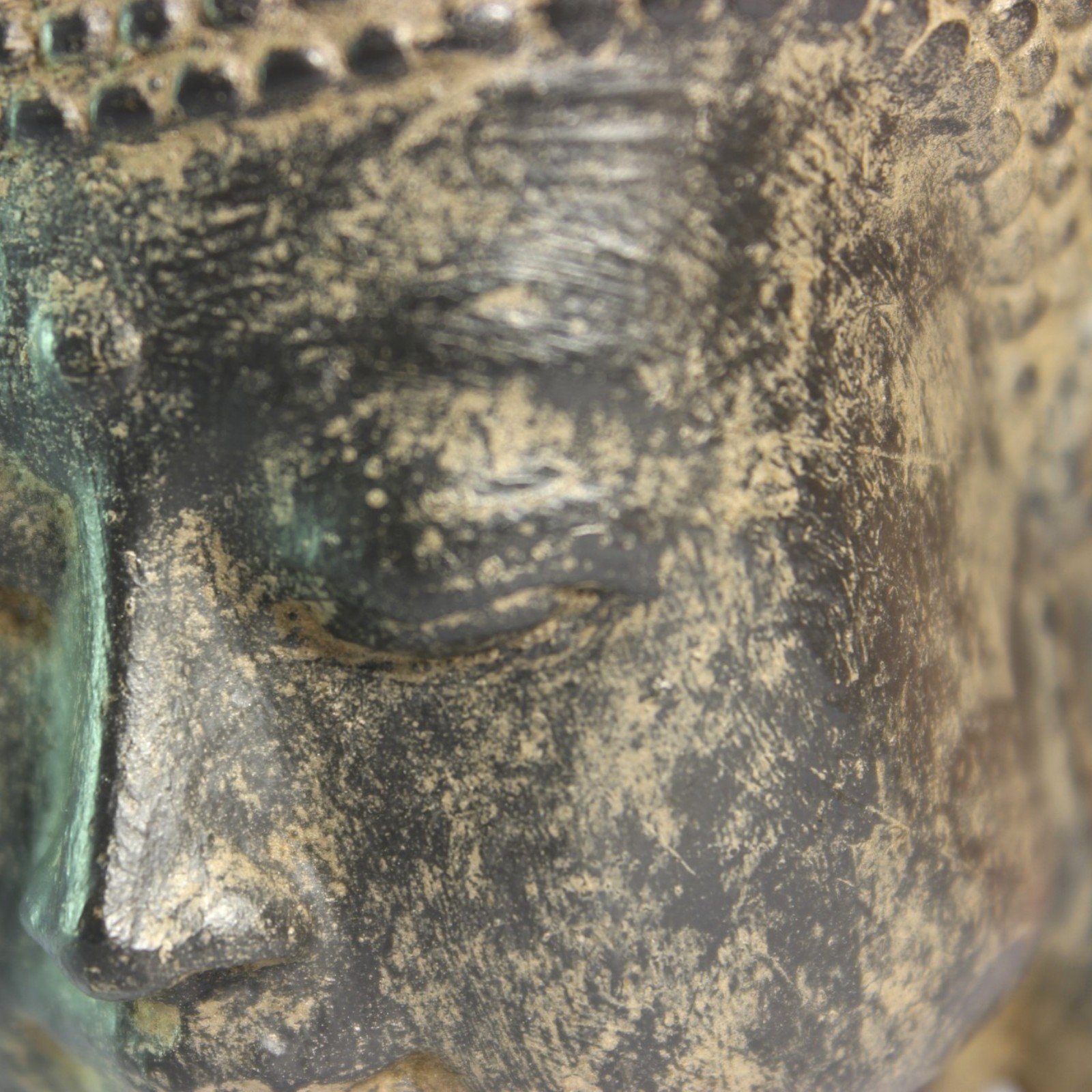 Close-up of the closed eye and brow area showing finish variation