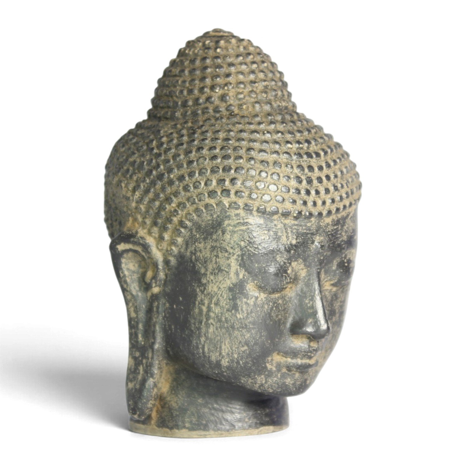Resin Buddha head statue, three-quarter front view with downcast eyes