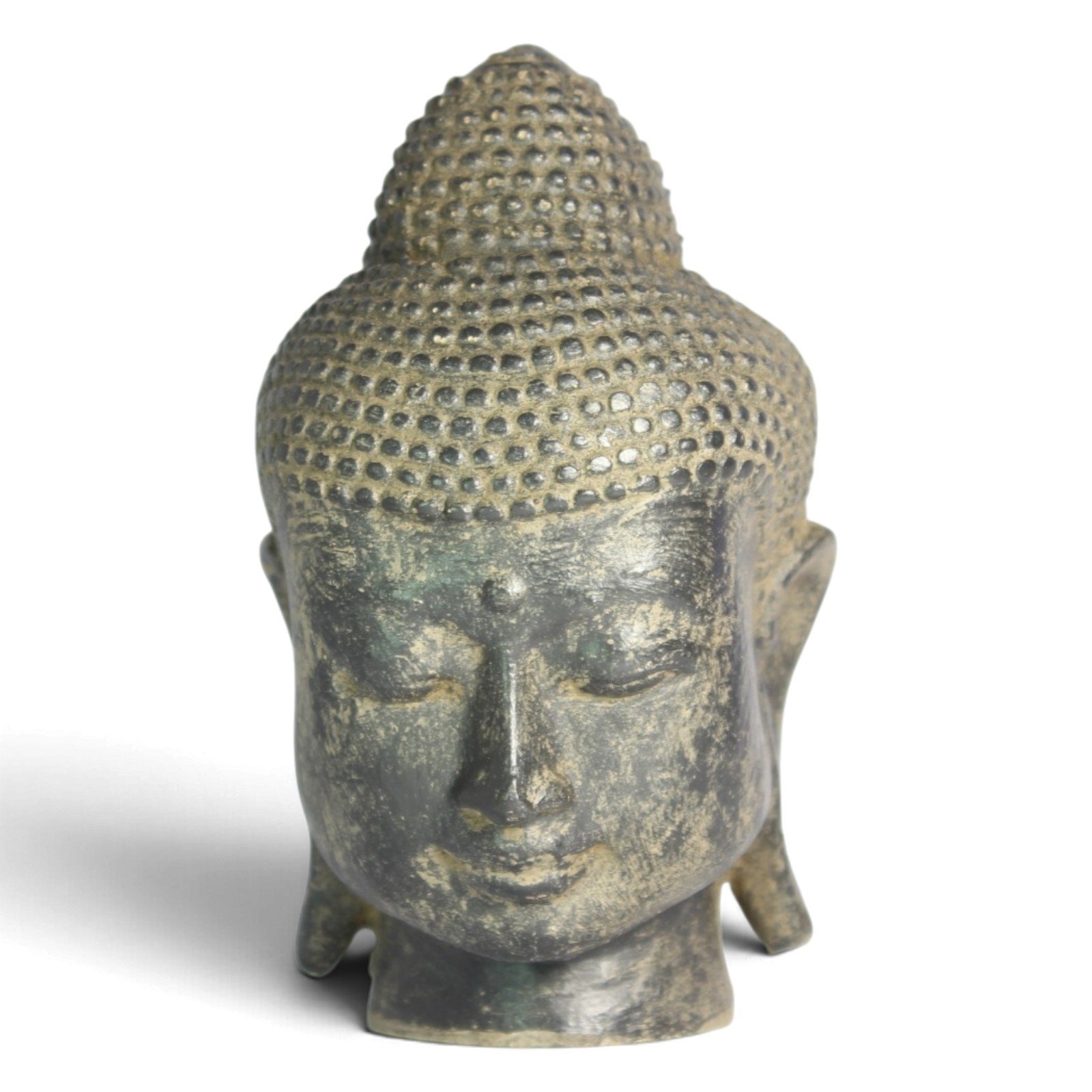 Buddha head statue shown straight-on from the front