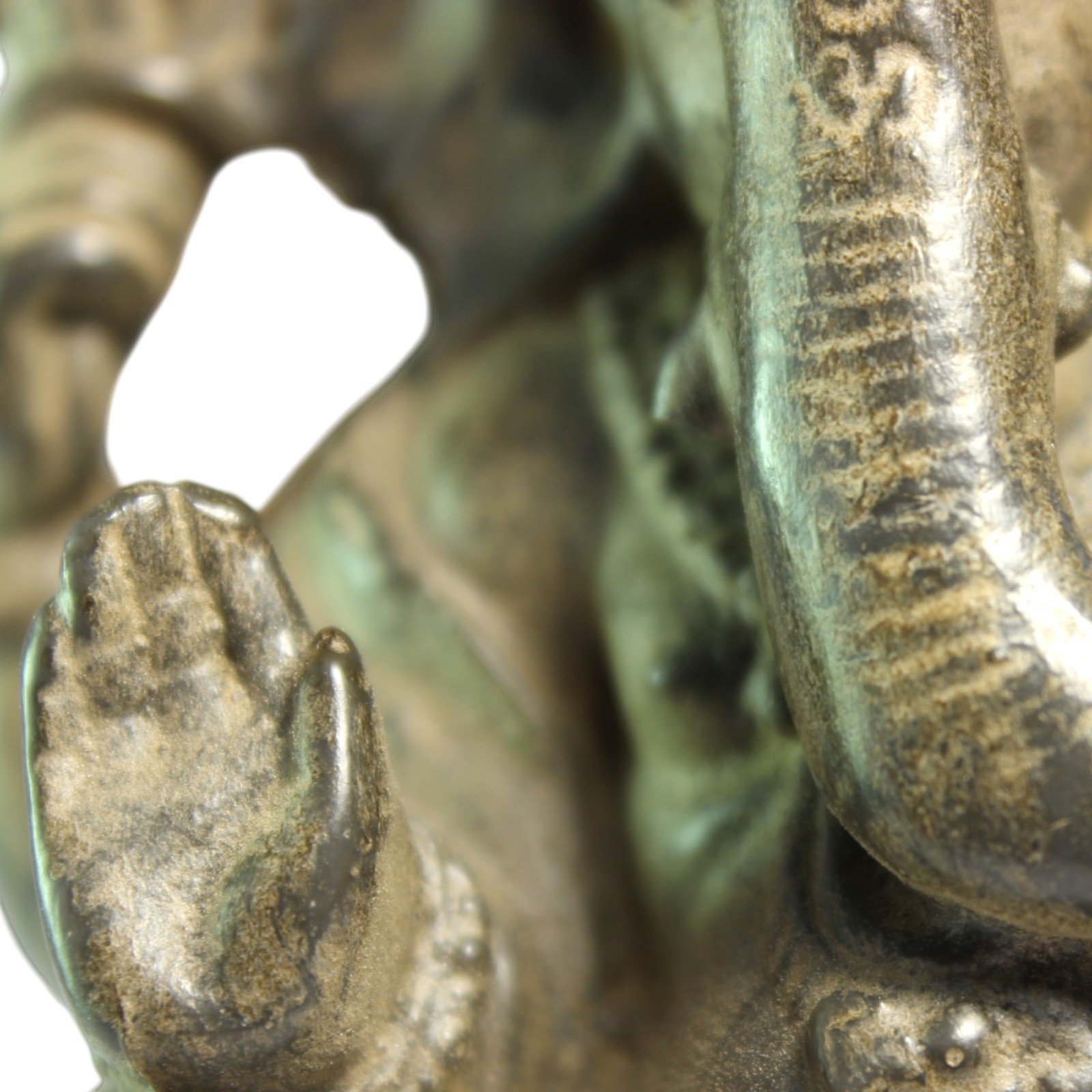 Close-up of raised hand showing finger detail and finish variation