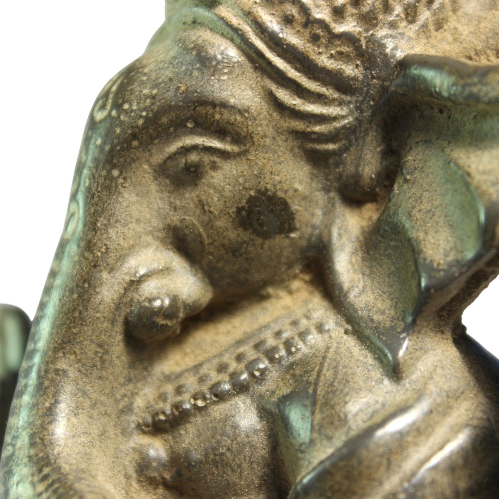 Close-up of chest and beaded jewelry detail on the statue