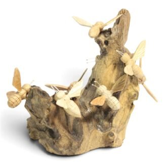 Hand-carved wooden bee stack on parasite wood base, full angled view