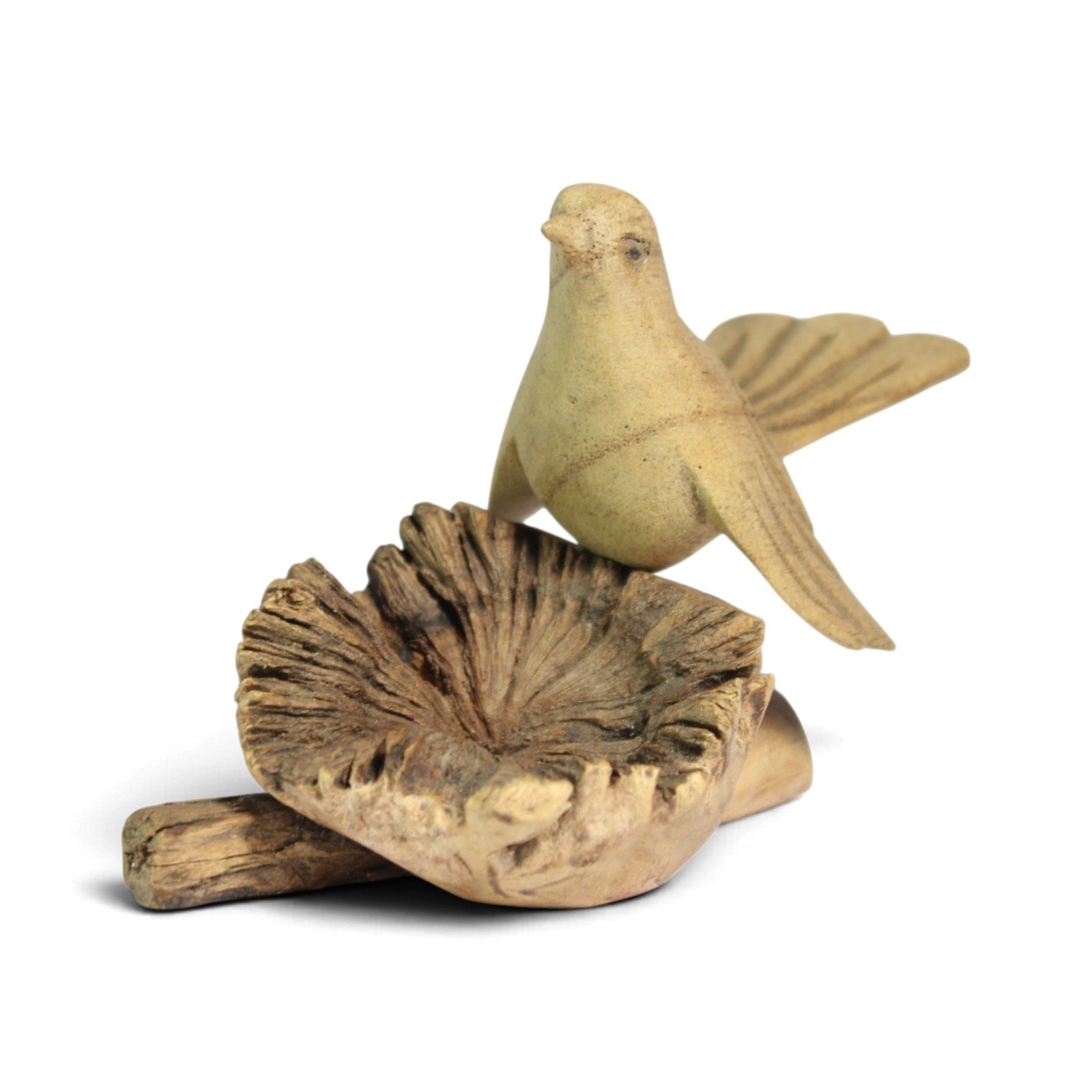 Wooden bird figure with wings spread, viewed from the front over its burl wood base