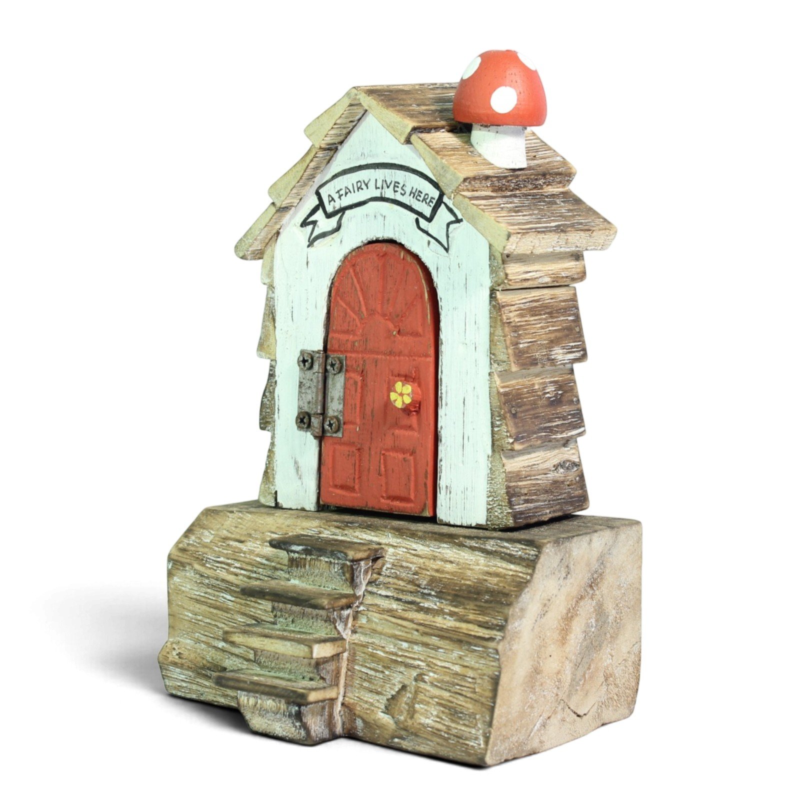 Three-quarter view highlighting the red door, flower knob, and toadstool chimney