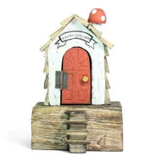 Front view of hand-painted wooden fairy house with red arched door and toadstool on roof