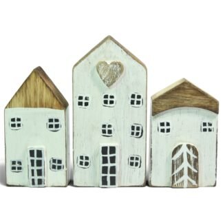 Three hand-carved wooden houses in white and mint, front view showing painted windows and doors