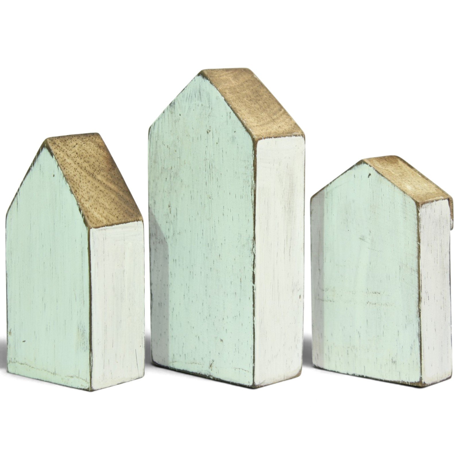 Side view of three wooden houses showing mint and white painted panels and natural wood roof grain