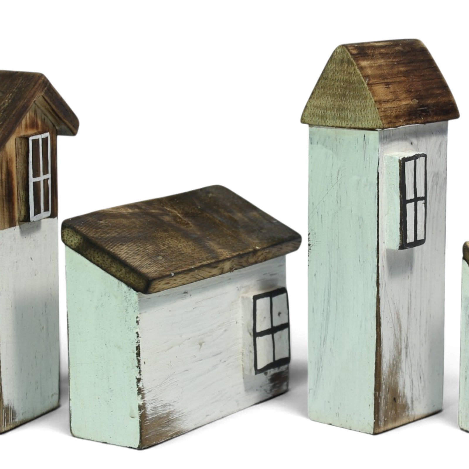Close-up of wooden houses with painted windows and visible brush strokes on the roofs