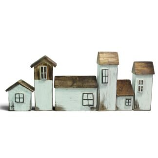 Set of six hand-carved wooden houses in white and natural wood tones, arranged in a row
