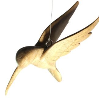 Close-up of carved wooden hummingbird head and wing with hanging wire attached