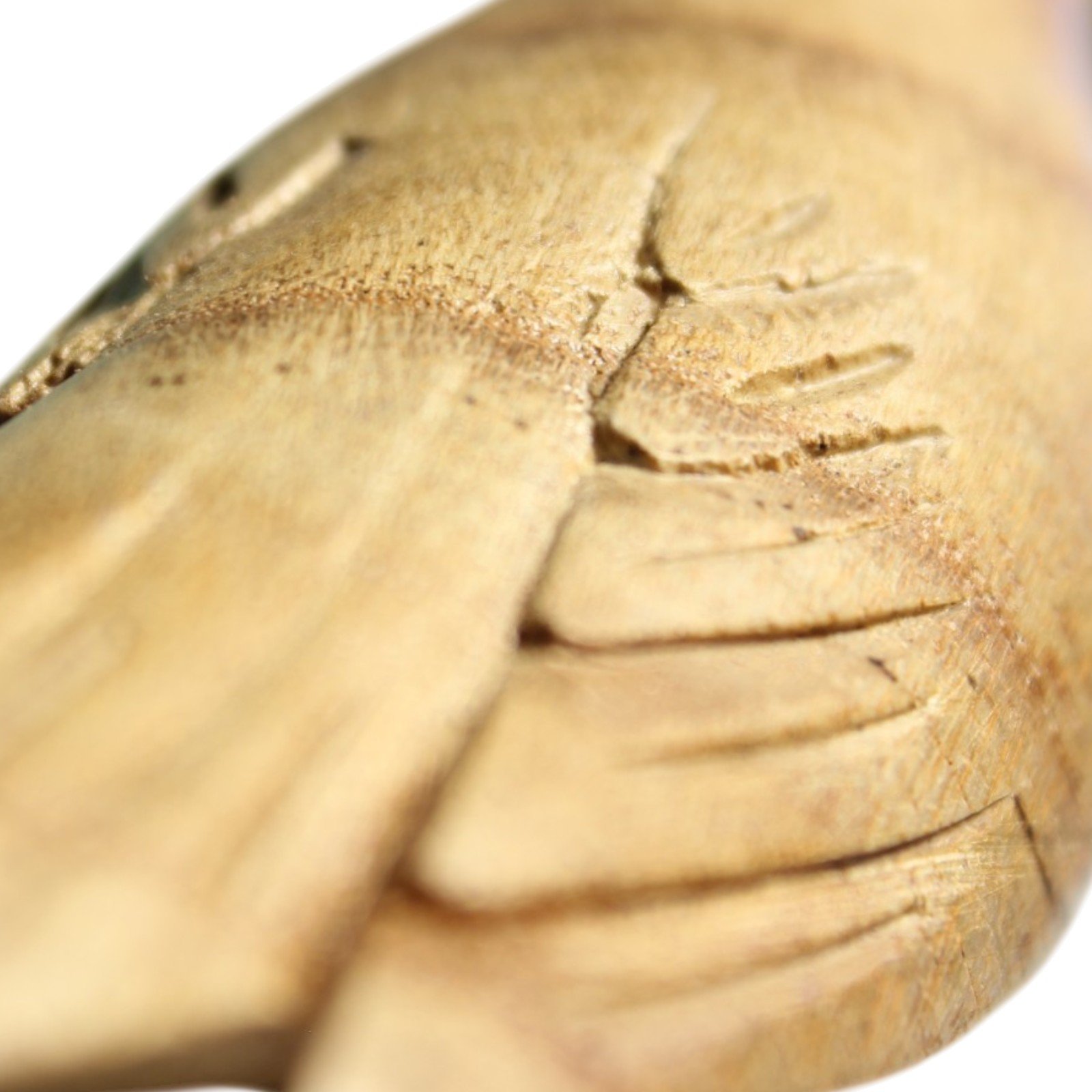 Two hand-carved wooden birds perched on a gnarled parasite wood base, back view.
