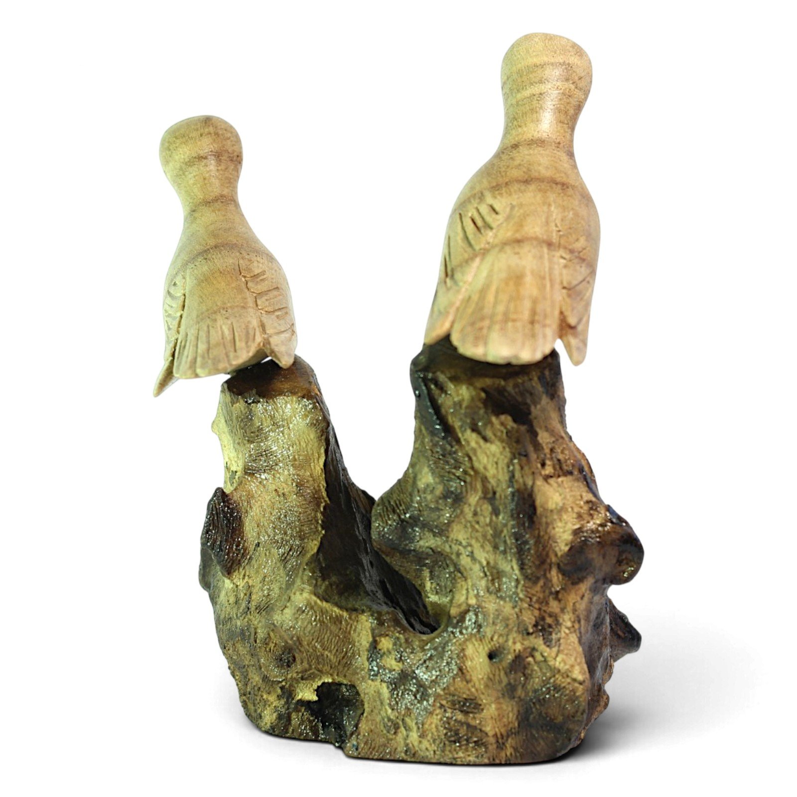 Back view of the carved bird pair showing tail feather detail and wood base