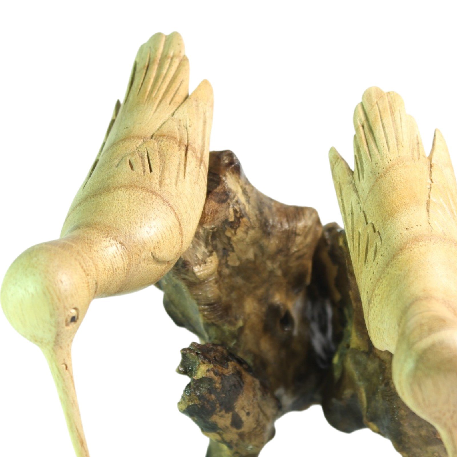 Two hand-carved wooden birds perched on a gnarled parasite wood base, top view