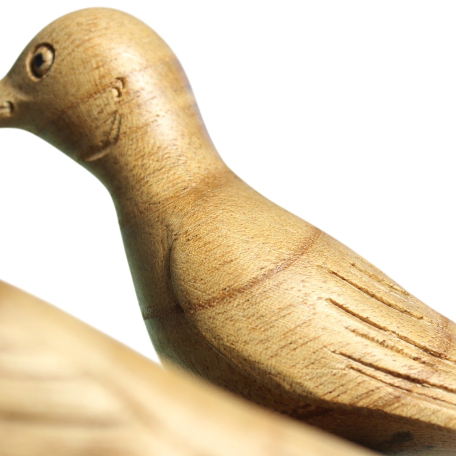 Close-up of carved neck and wing feather lines on one bird