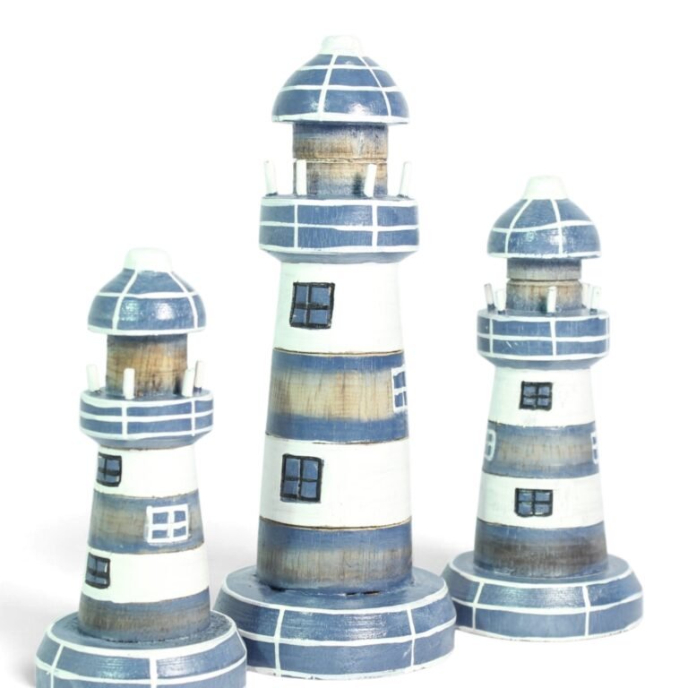 Set of three hand-carved wooden lighthouses in blue and white, arranged by height