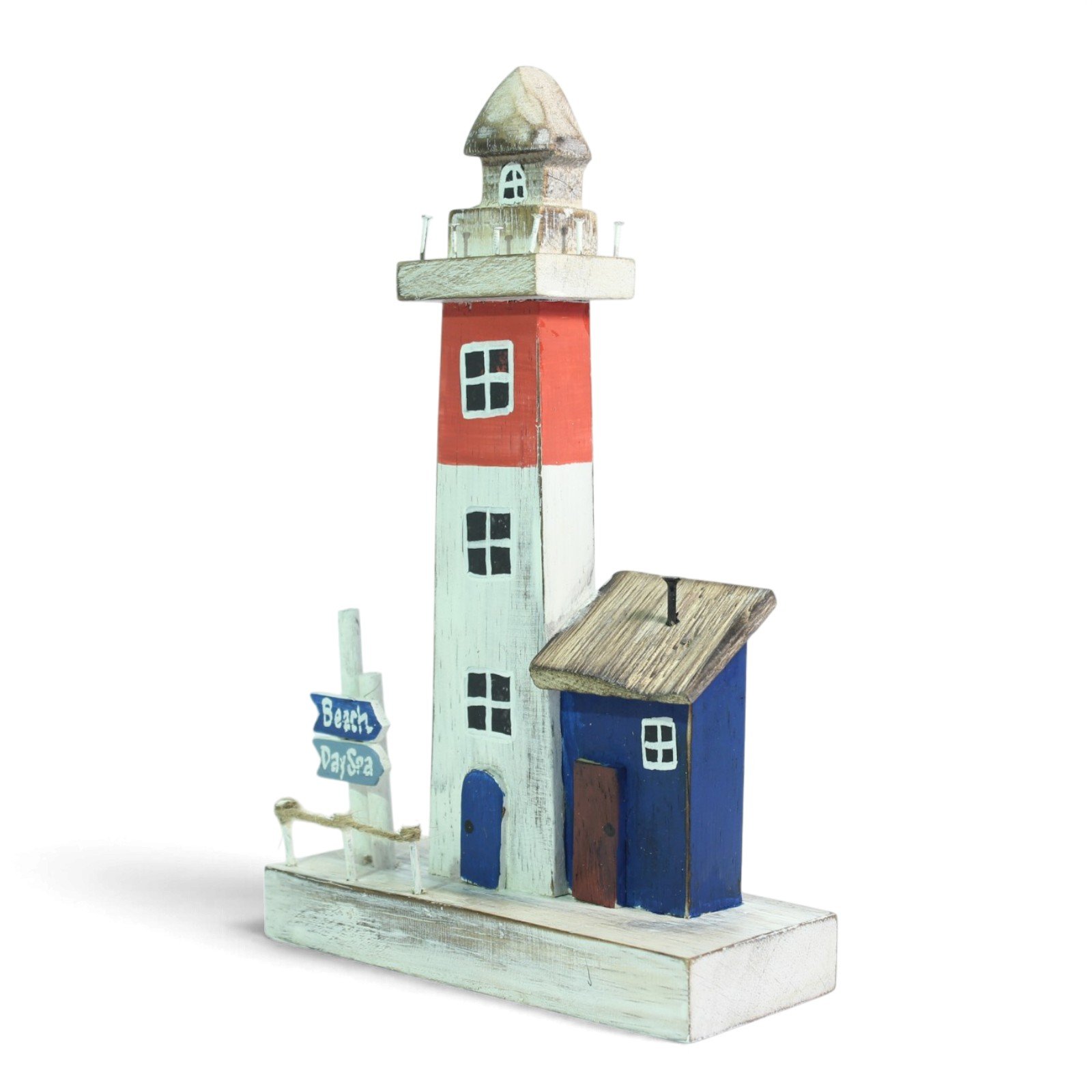 Angled view showing the lighthouse tower, cottage, and signpost together