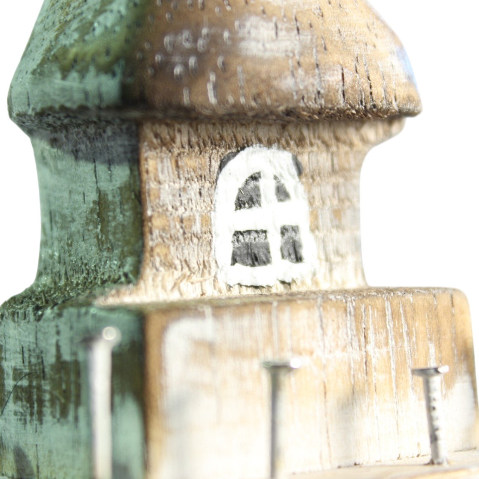 Close-up of the lighthouse lantern room with a small painted window