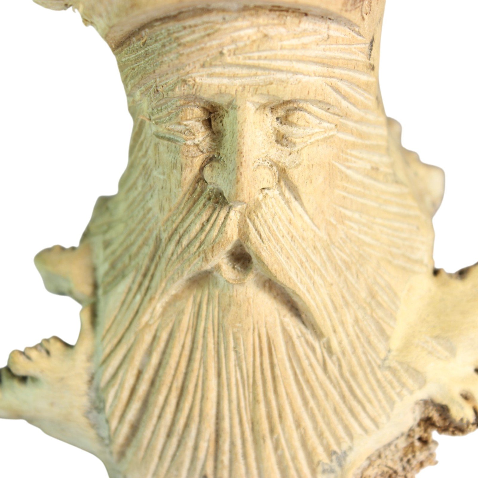 Front-facing close-up of the lower bearded face showing carved beard lines