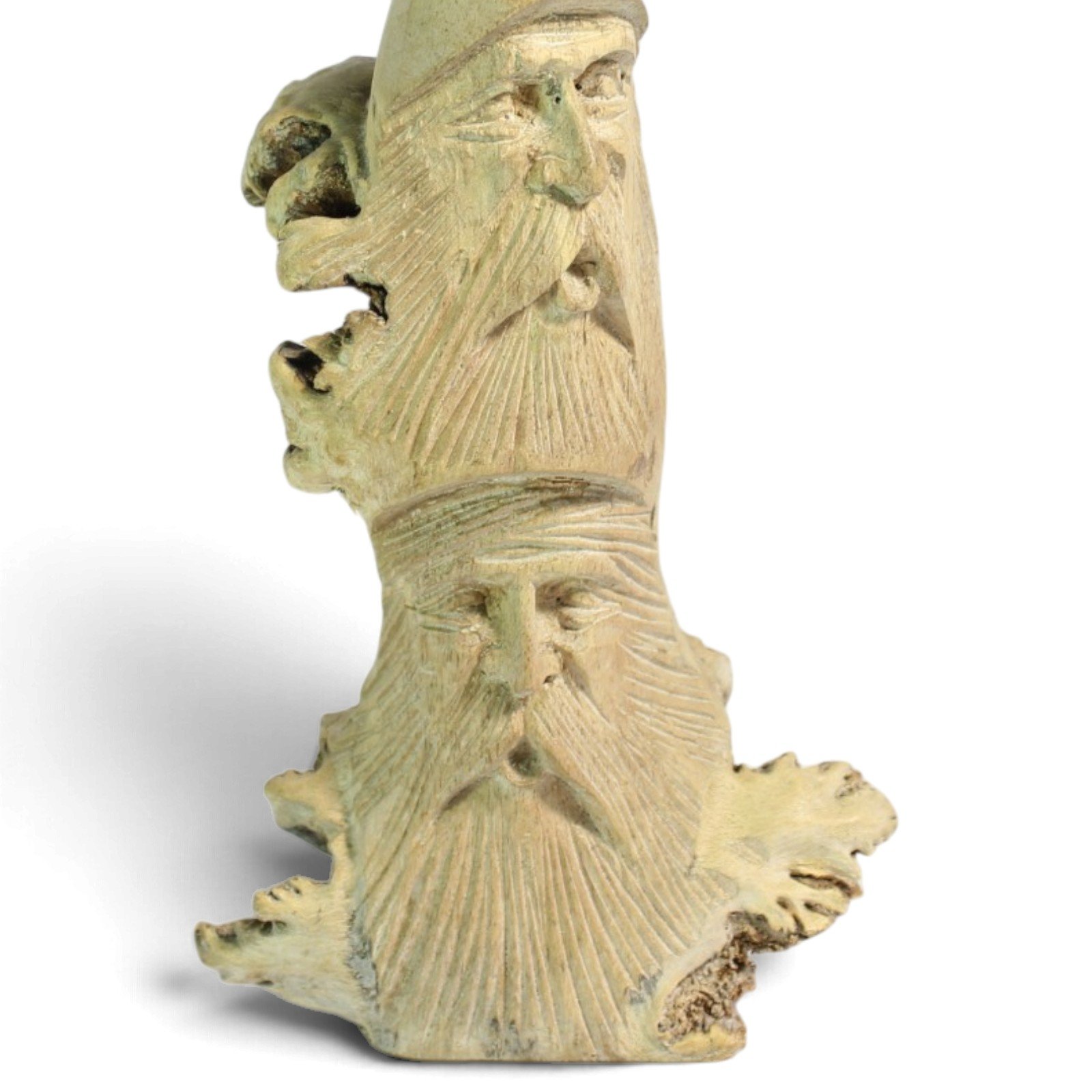 Close-up of the carved bearded faces showing detailed beard texture and wood base