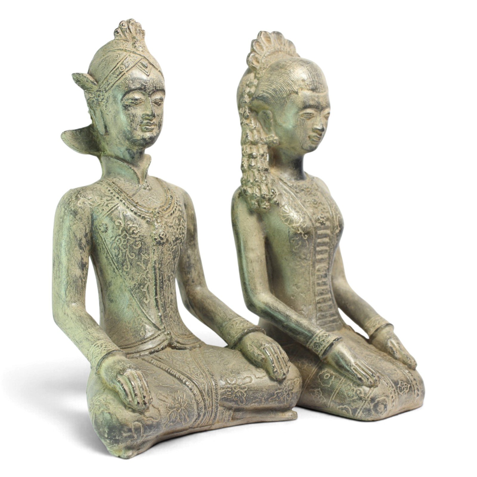 Three-quarter angle view of the seated Javanese wedding couple statues