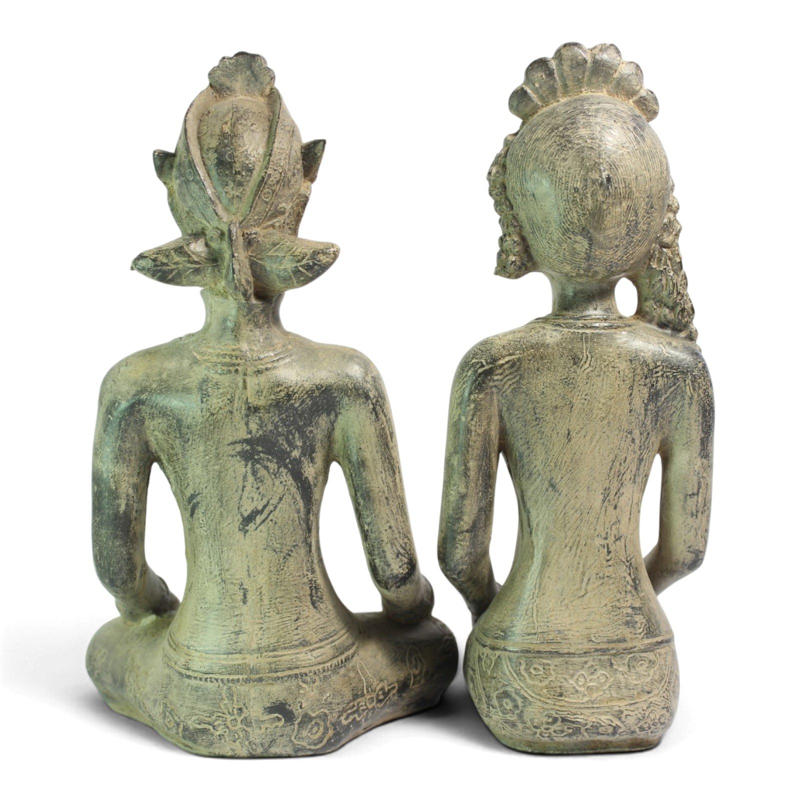 Back view of both statues showing headdress and hair carving detail