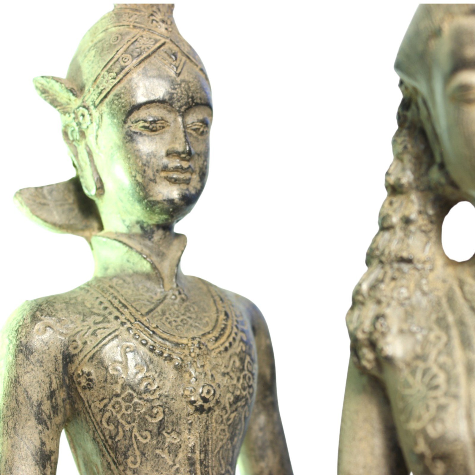 Close-up of the male figure's torso and jewelry detailing