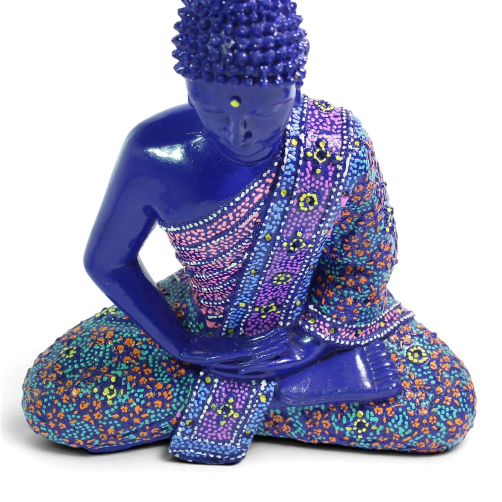 Close-up of Buddha's face showing serene expression and topknot detail